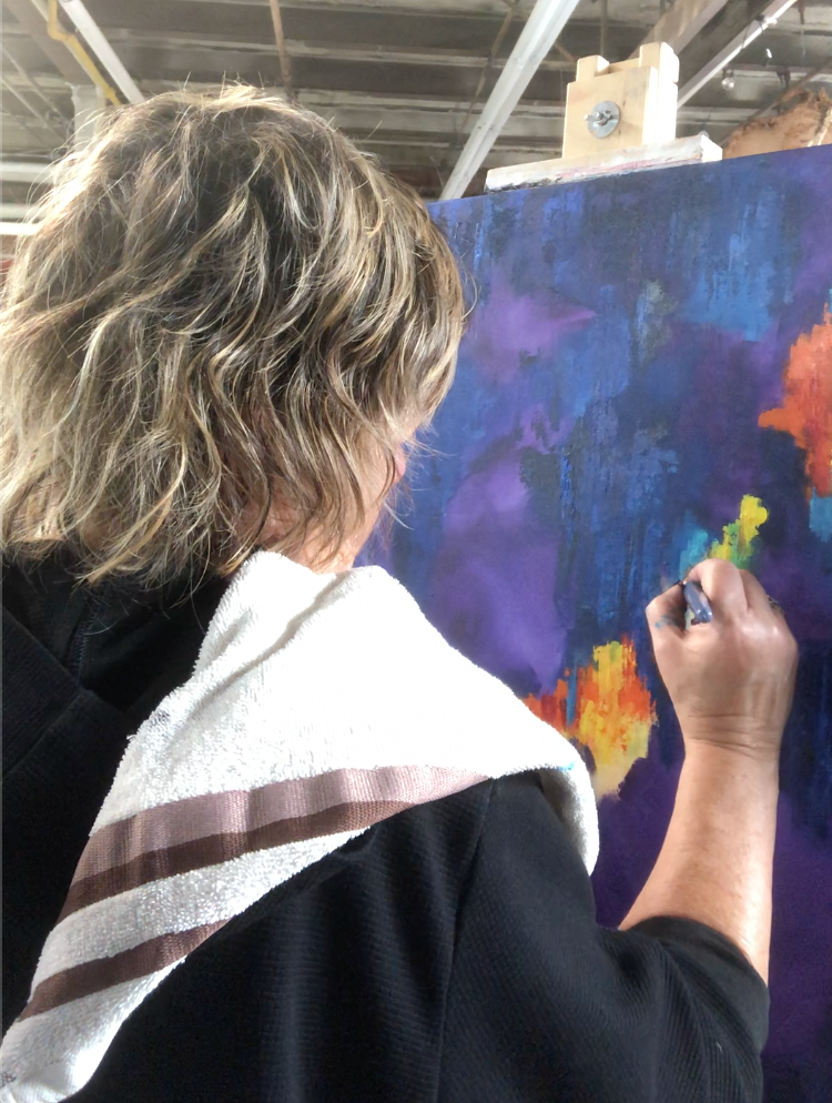 Artist Karen Klucowicz painting in Hamilton studo
