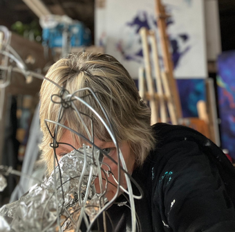 Karen Klucowicz working on sculpture in studio