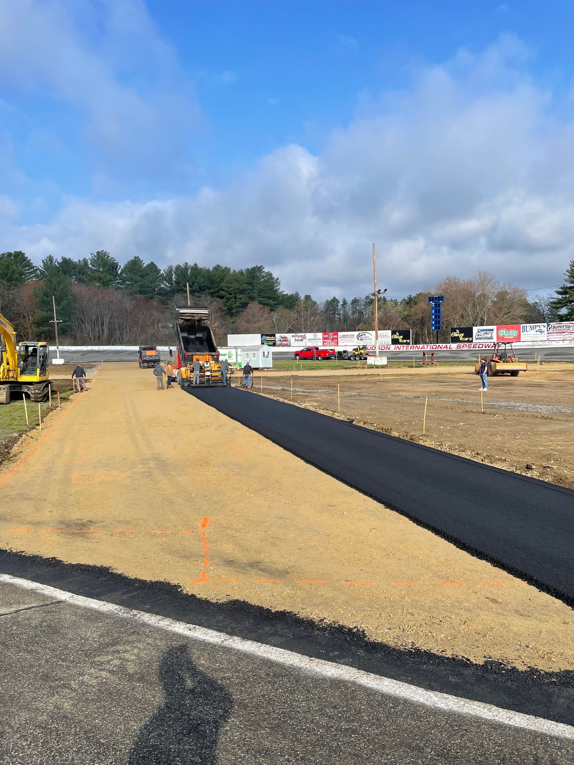 A road is being paved on the side of the road