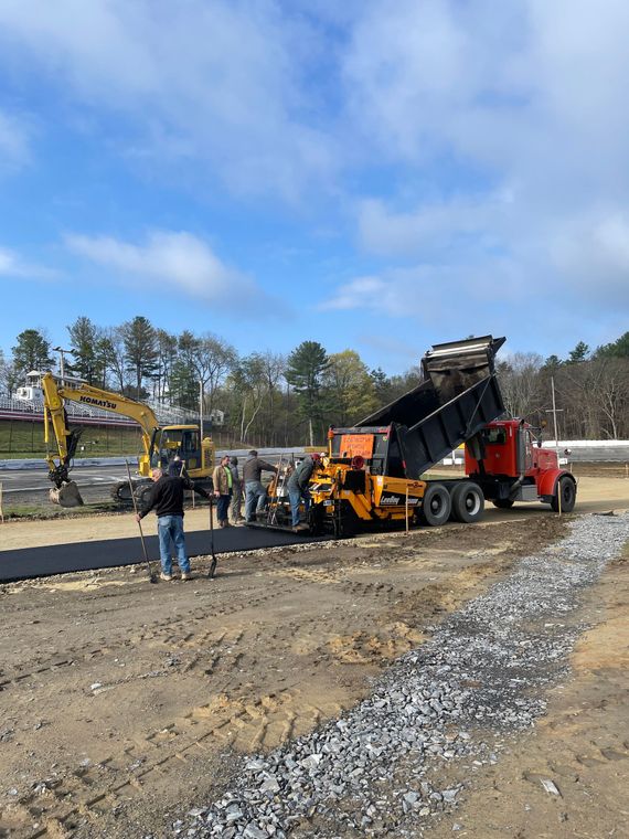 A roller is rolling asphalt on a road