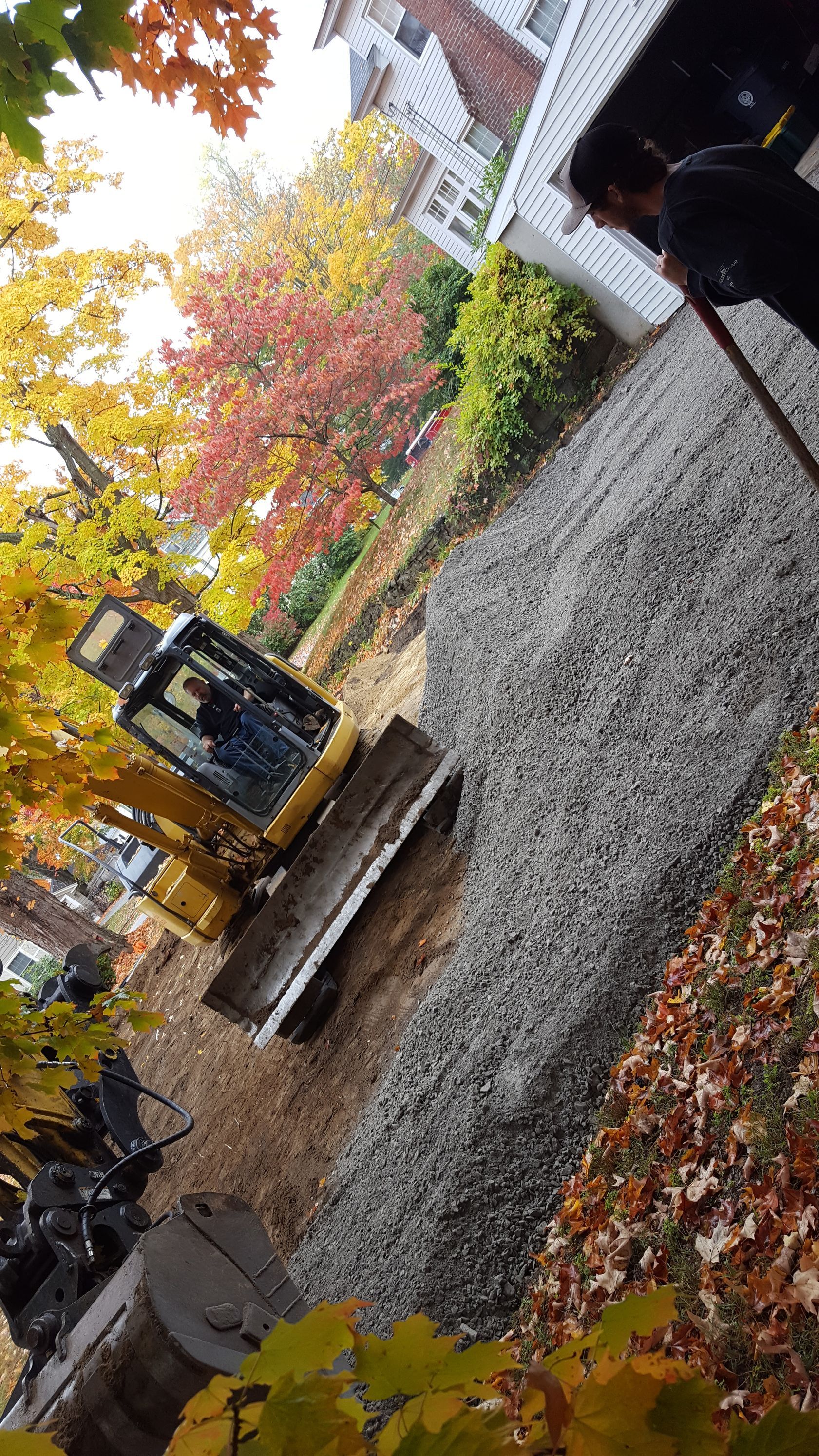 A bulldozer is sitting on top of a pile of gravel
