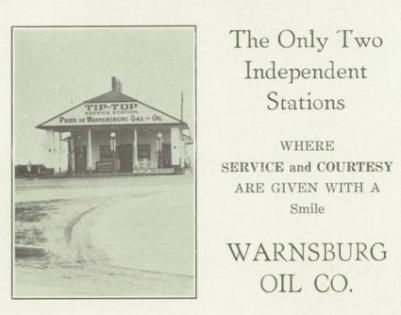 Advertisement for Warnsburg Oil Co., featuring an old gas station, 