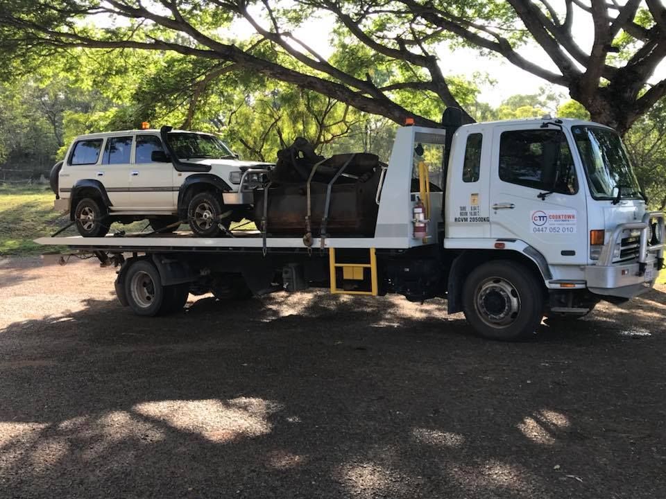 A White Tow Truck is Carrying a White SUV on Its Flatbed — Cape York Towing in Julatten, QLD