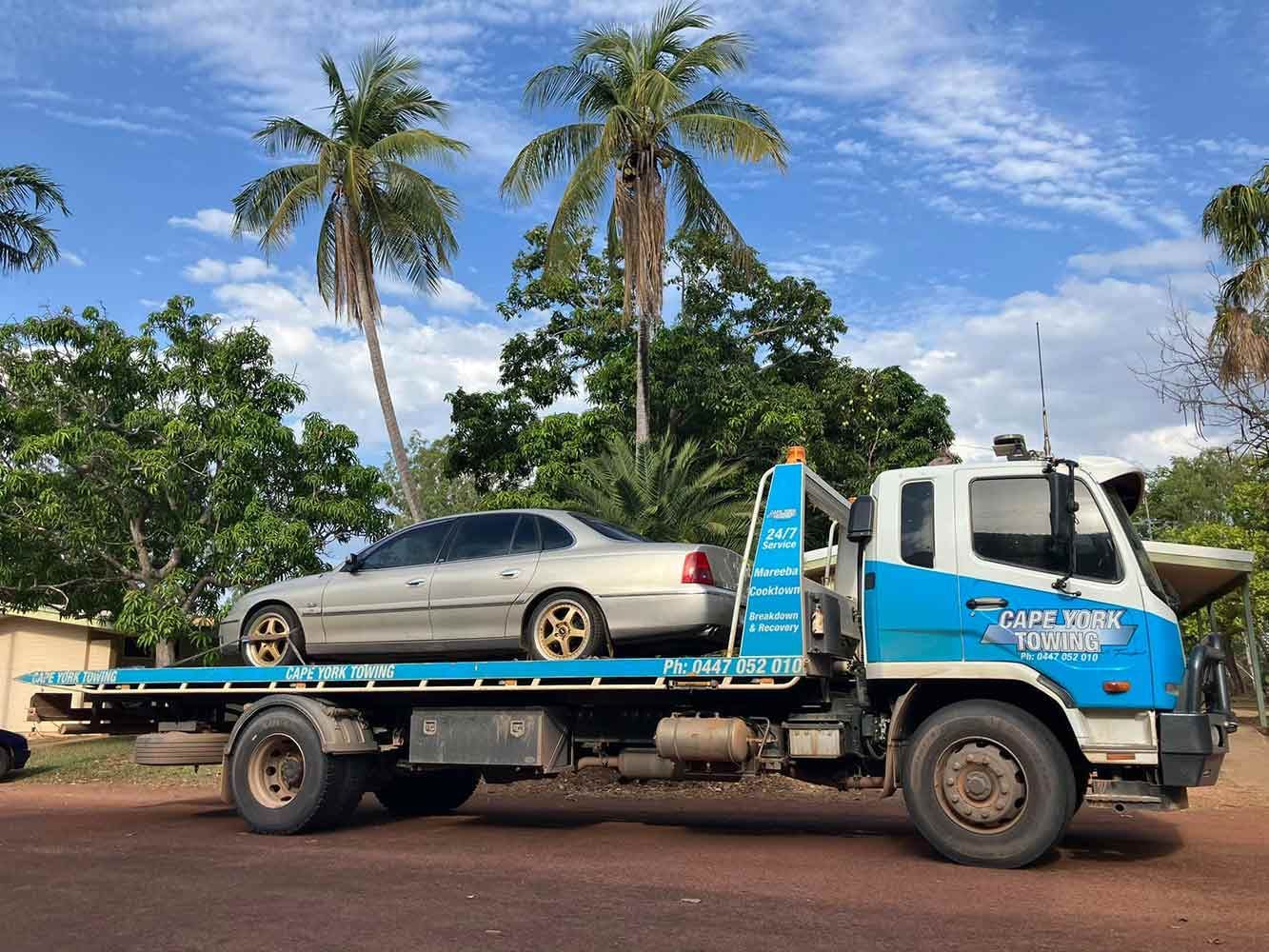 A Tow Truck With a Car on the Back of It — Cape York Towing & Transport in Sydney, NSW