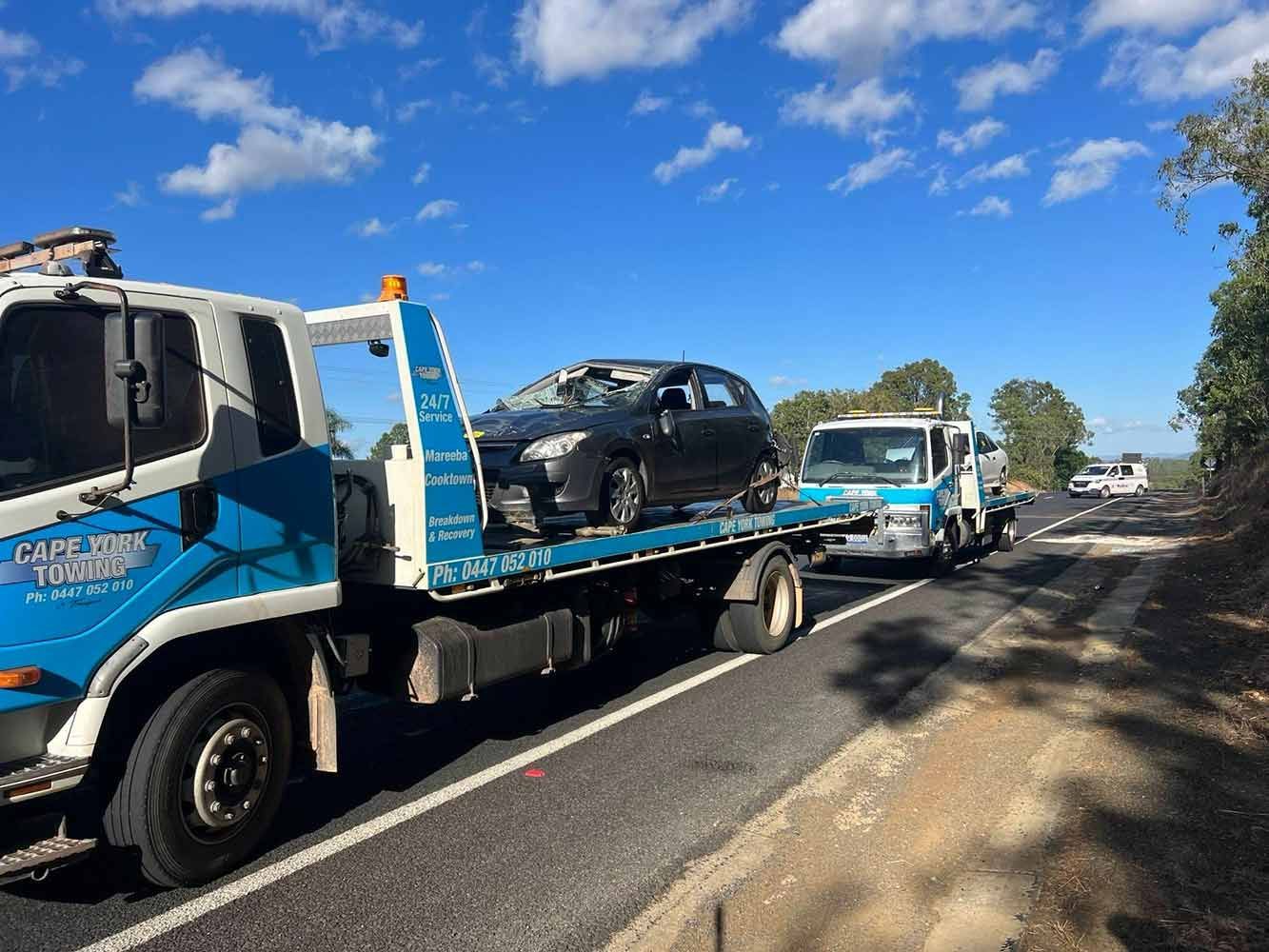 A Tow Truck is Carrying a Car on the Back of It — Cape York Towing & Transport in Coen, QLD