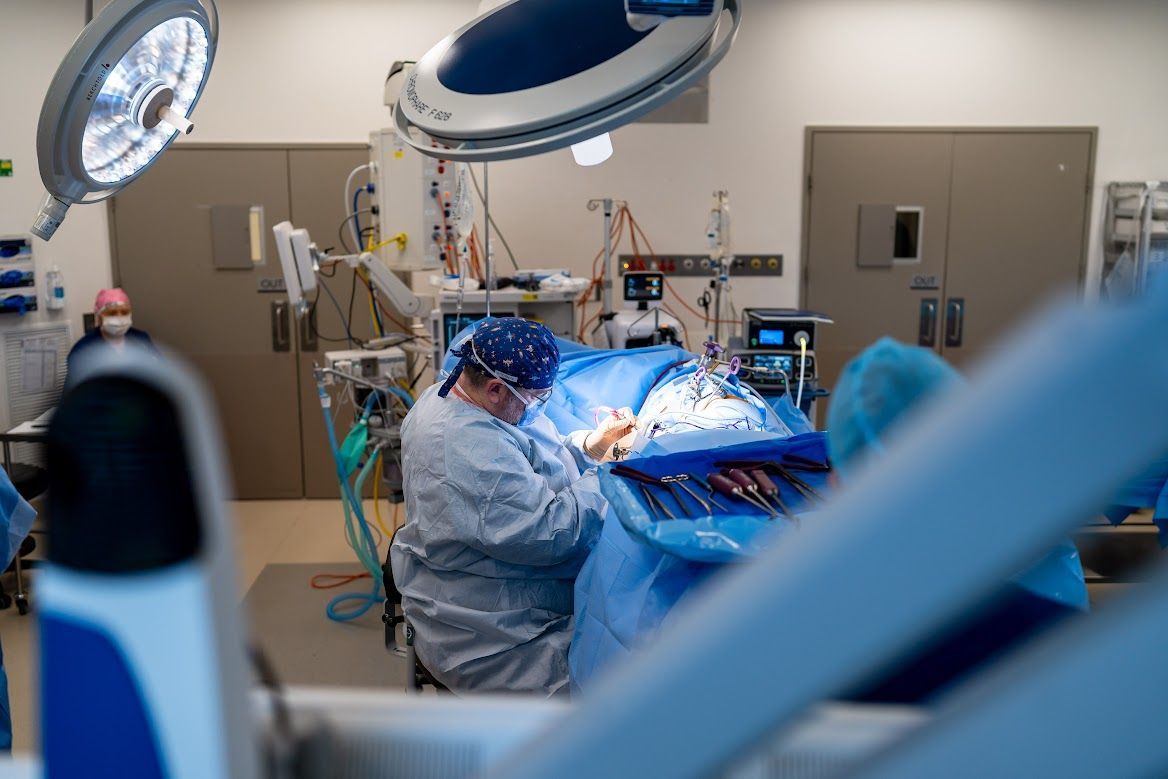 Dr Thomas Pitham operating a patient