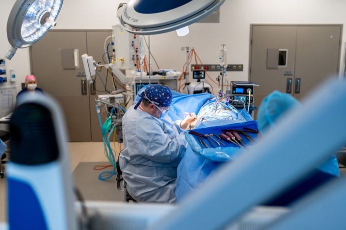 Dr Thomas Pitham working on a patient