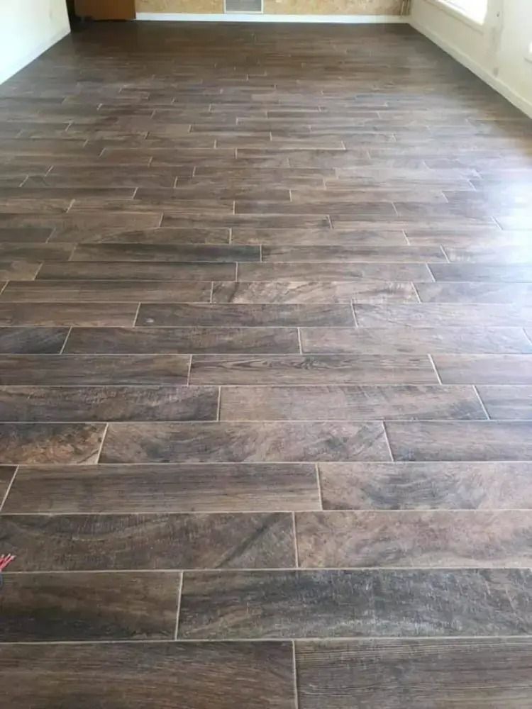 Empty room with dark wood-look flooring and light-colored walls
