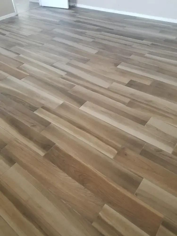 Empty room with light wood flooring and white walls