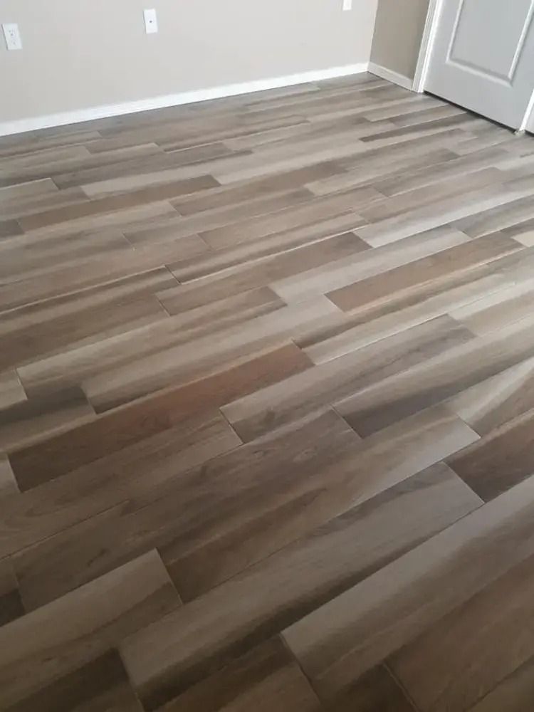 Empty room with light wood-look flooring and white walls