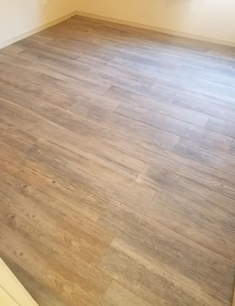 Empty room with light wood-look flooring and beige walls
