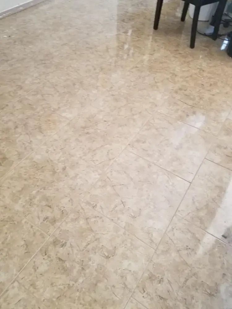 Marble-tile floor with chair legs visible in the upper right corner.