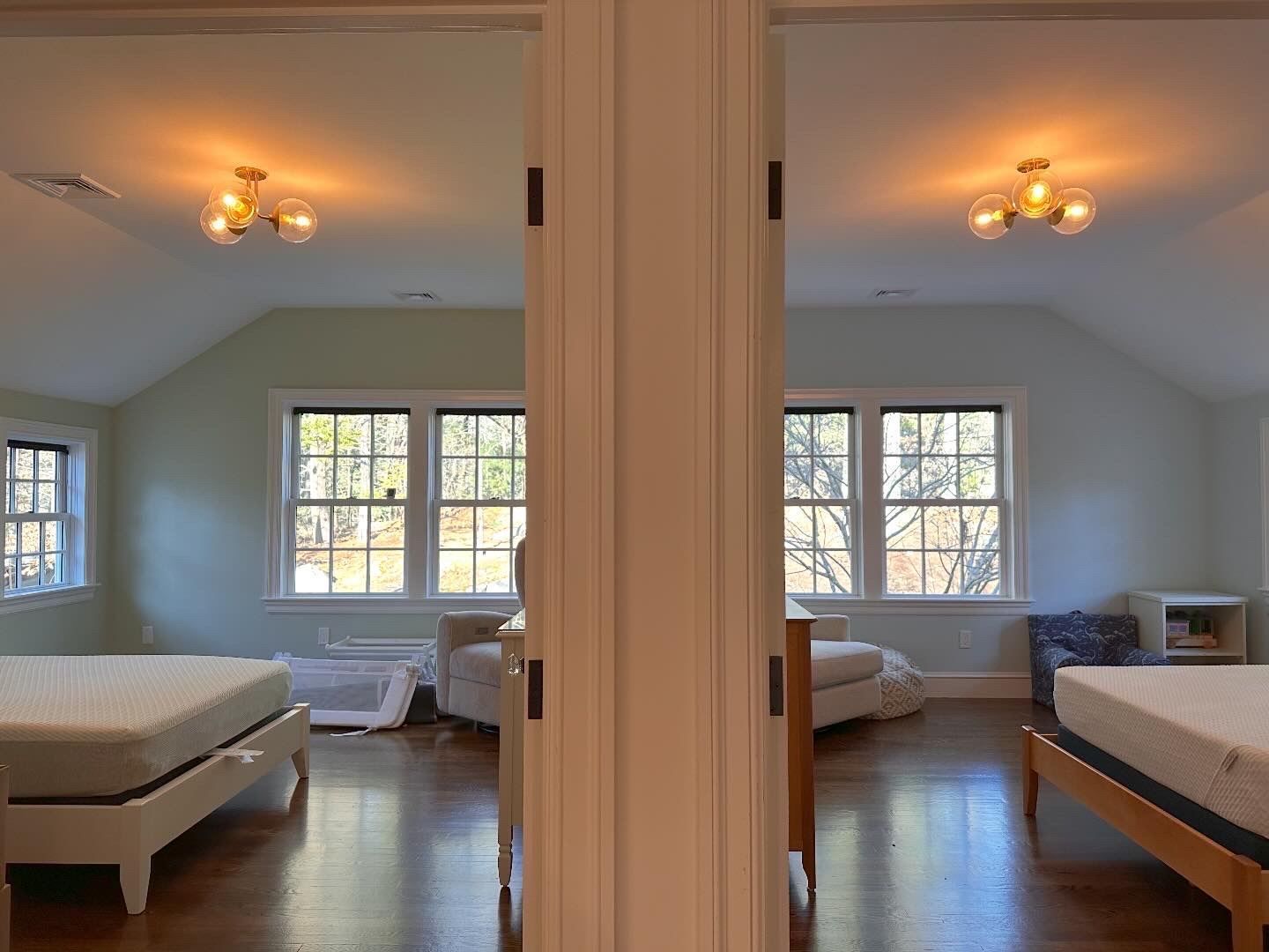 Split-view of a bright attic bedroom with white beds, windows, and wooden floors
