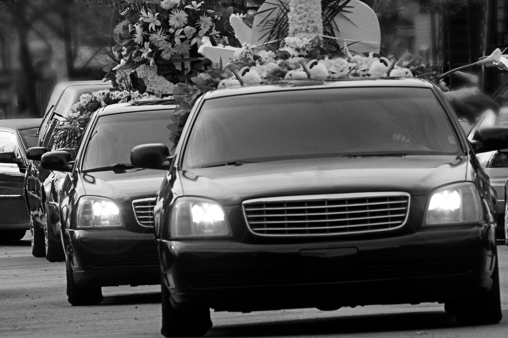 funeral procession in black and white