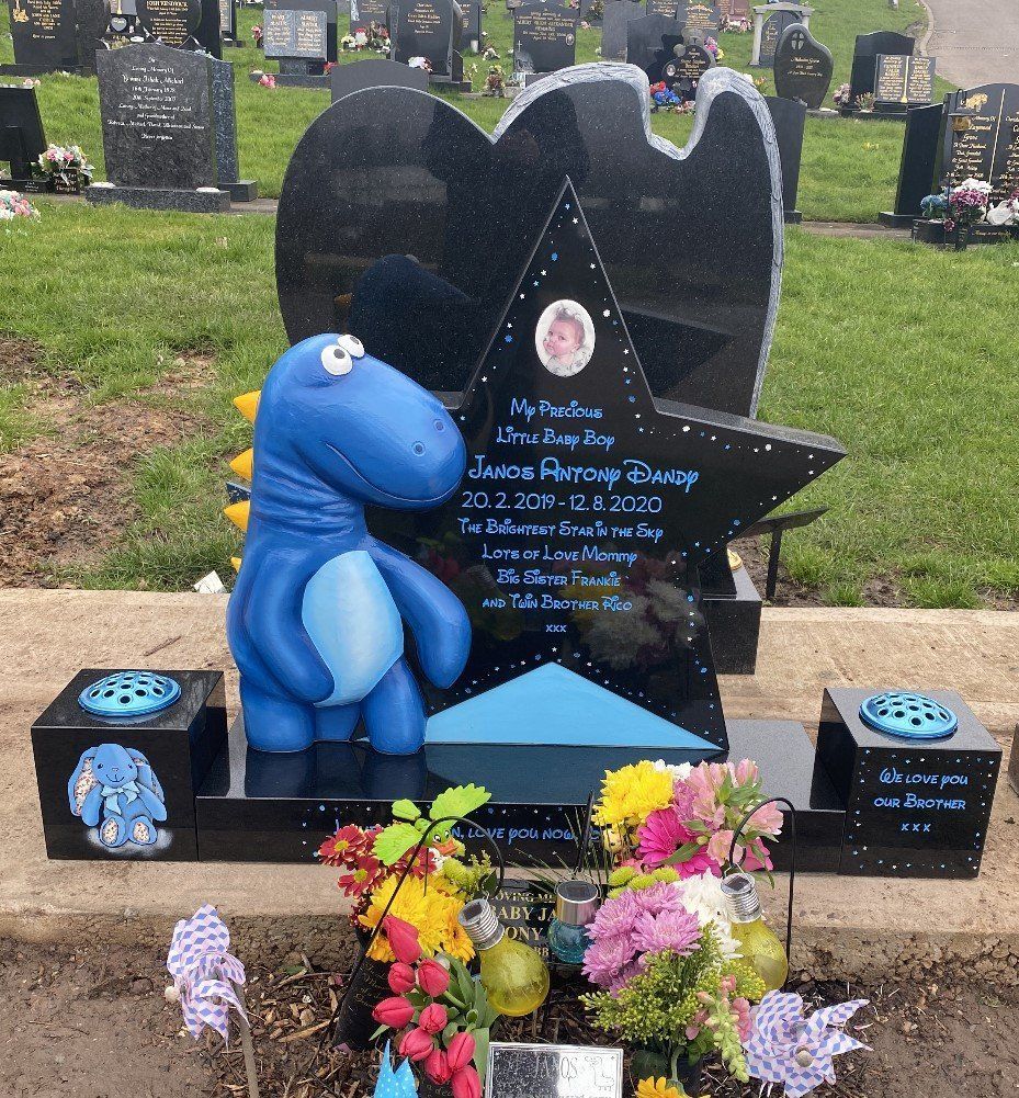 blue dinosaur headstone