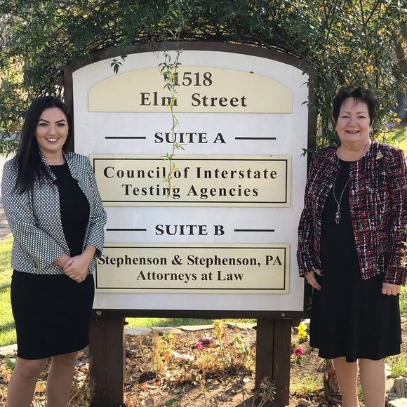 Two Women Next to the Sign — Sanford, NC — Stephenson & Stephenson PA Attorneys at Law Two Women Next to the Sign — Sanford, NC — Stephenson & Stephenson PA Attorneys at Law