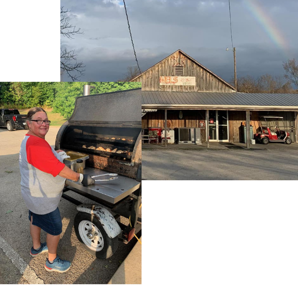 Woman grilling beside a smoker in a parking lot, with a rustic building and rainbow in the background
