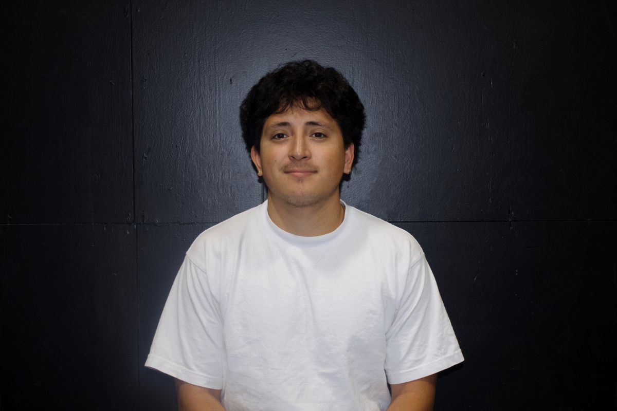 Young person wearing a red shirt with 