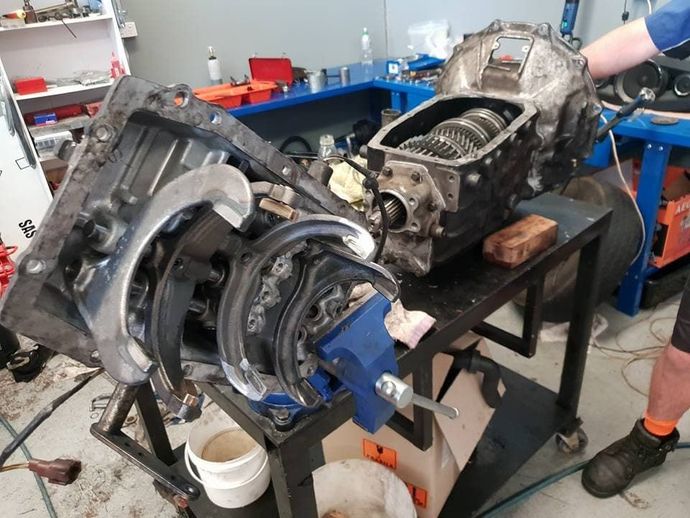 A Mechanic Repairs a Car Engine in a Well Equipped Workshop — Maroochy Automotive in Maroochydore, QLD