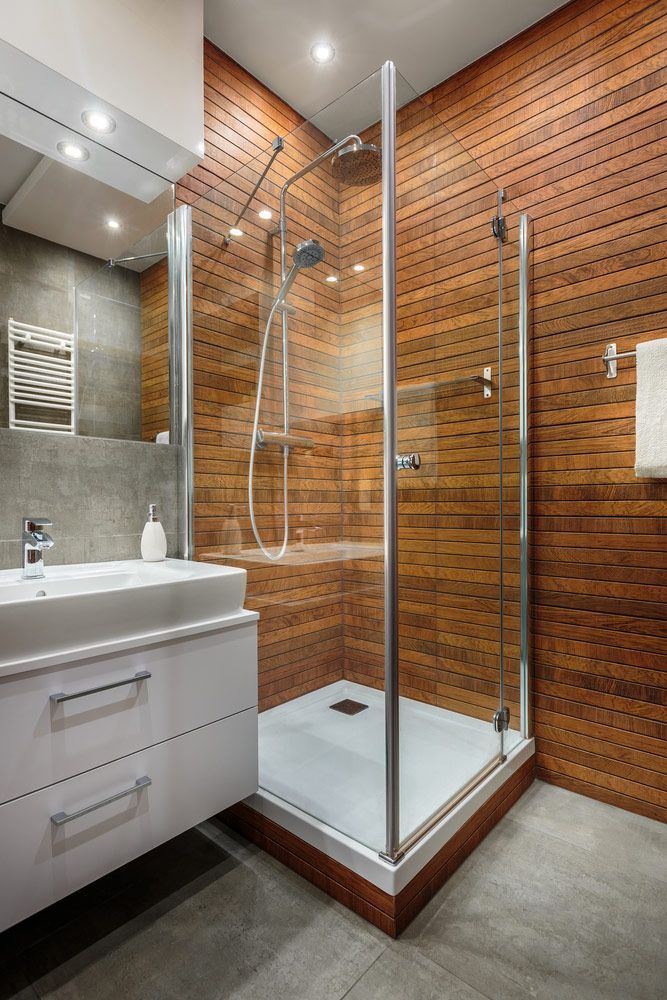 A Bathroom With A Walk In Shower, Sink, Mirror And Wooden Walls — InStyle Shower Screens & Wardrobes in Lake Macquarie, NSW