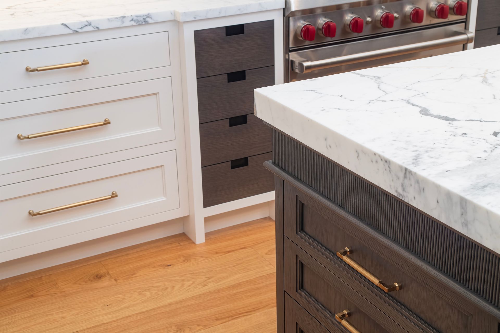 Kitchen cabinets with white drawers, a dark wine fridge, and a marble countertop on wood flooring
