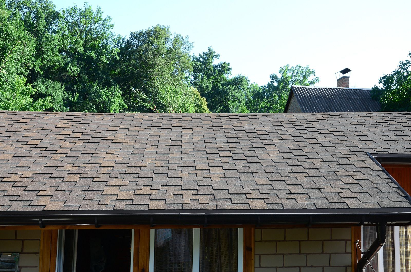 Wooden cedar shake shingles on a roof.