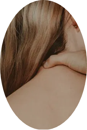 A woman is getting a massage on her neck.