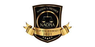 Black and gold legal award badge reading “Nation’s Premier Top Ten Attorney 2021” with scales icon