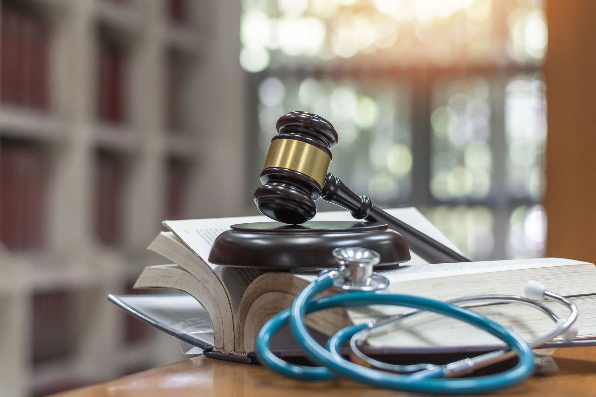medical practice justice concept with judge gavel on law text book