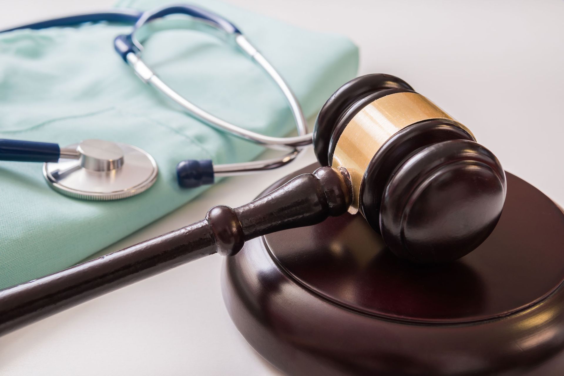 gavel and stethoscope in background