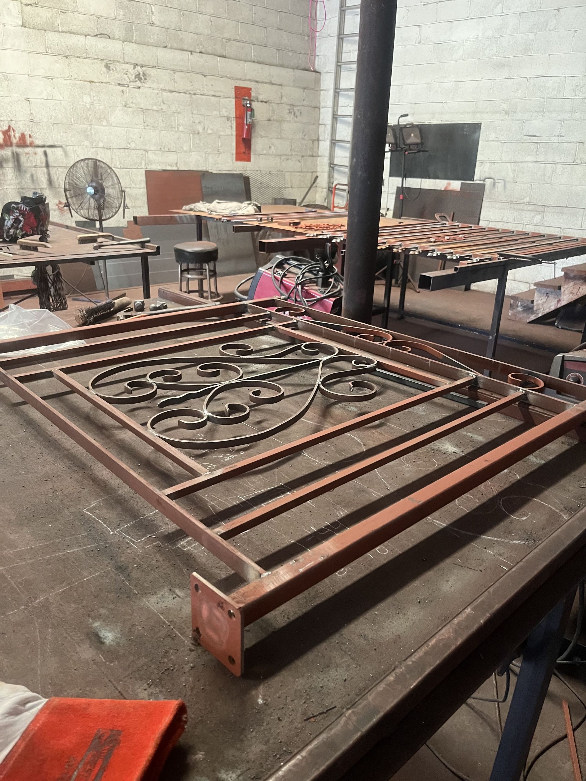 A piece of metal is sitting on a table in a workshop