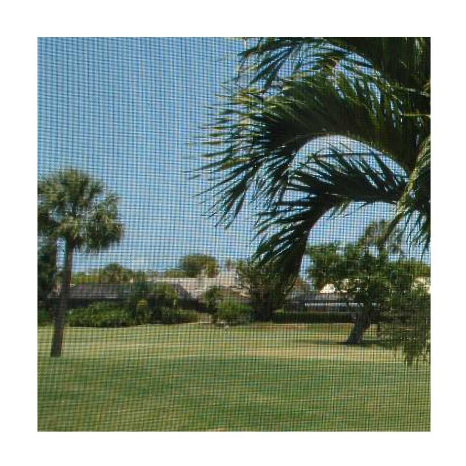 View through a screen of a grassy field with palm trees and houses against a blue sky.