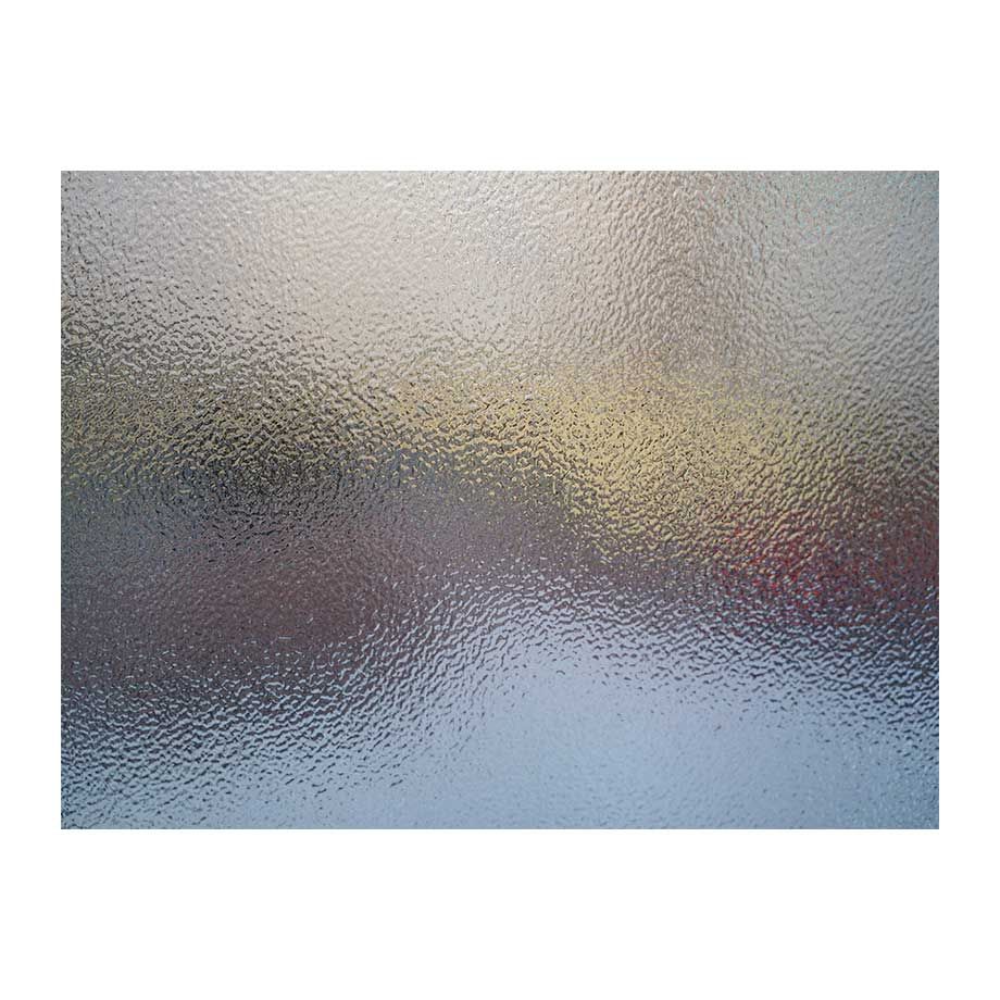 Textured glass with blurred background of various colors.