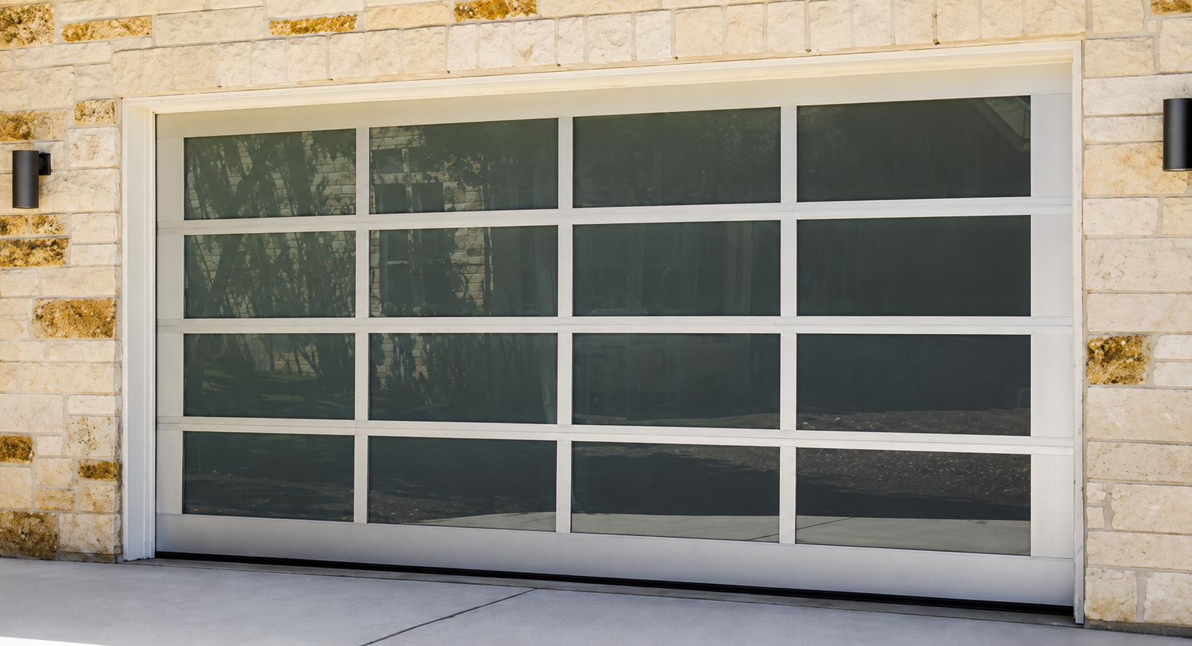 Modern glass garage door set in a stone exterior wall