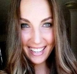 A close up of a woman smiling for the camera.