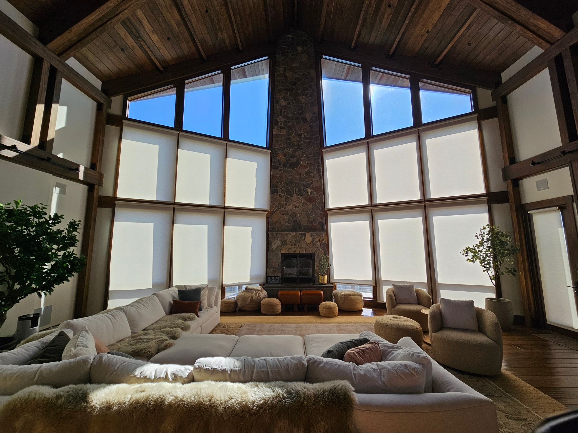 A living room with a couch , chairs , and a fireplace.