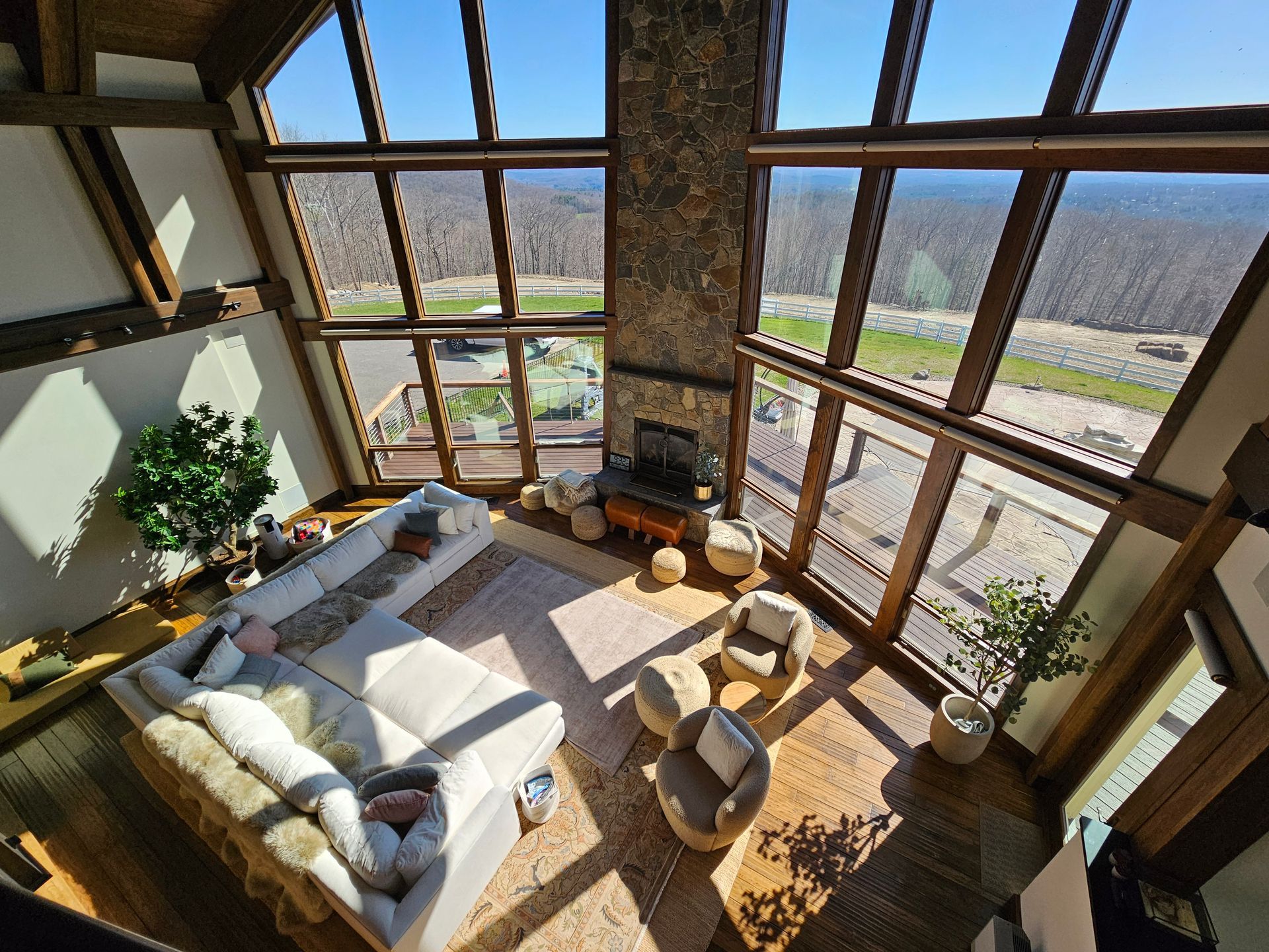 An aerial view of a living room with a couch and chairs.