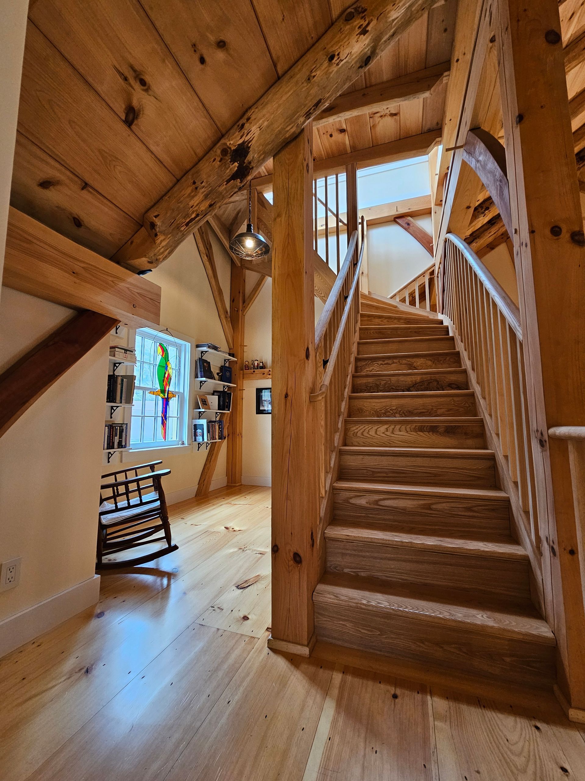 A wooden staircase leading up to the second floor of a house