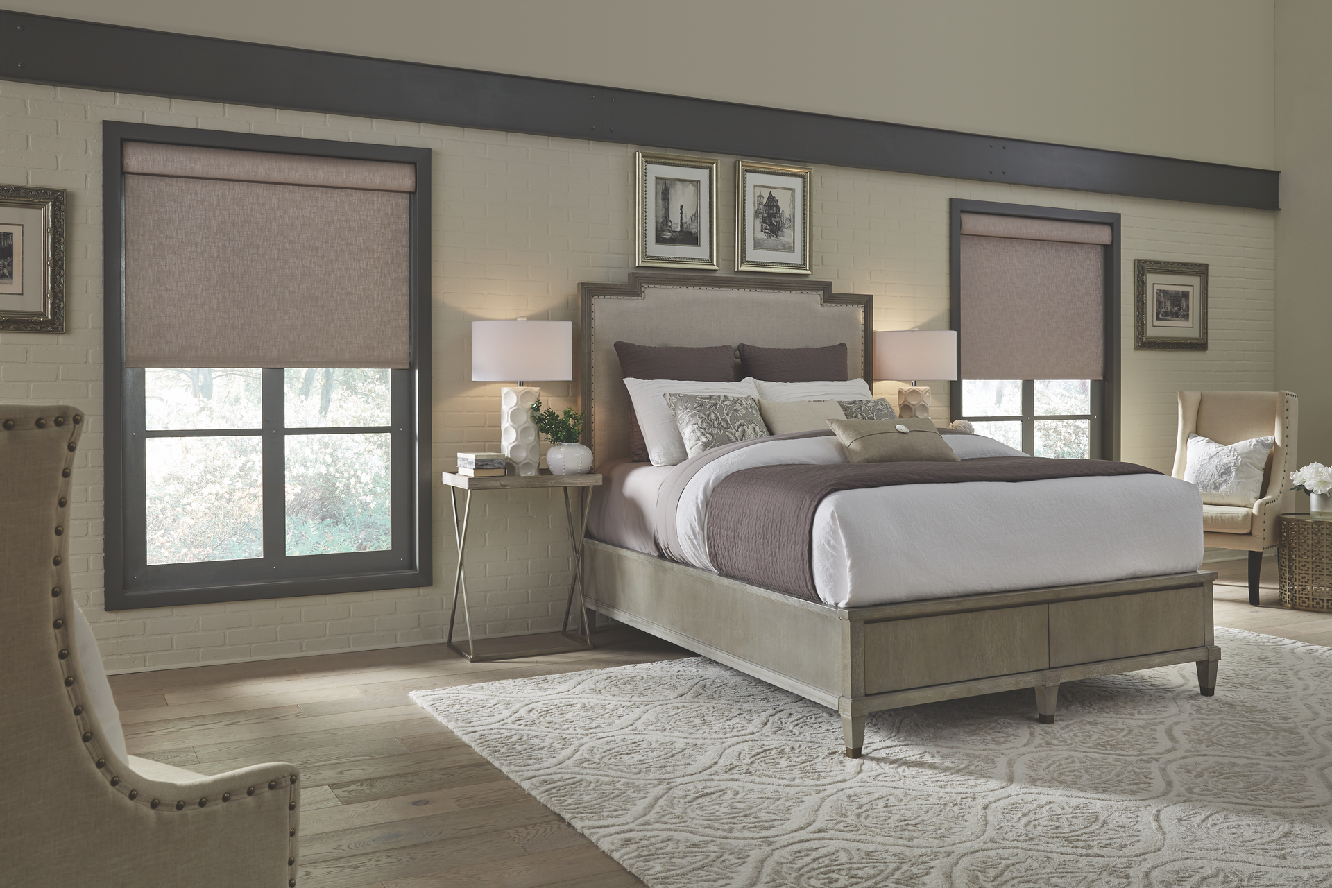 A bedroom with a bed , chairs , lamps and a rug.