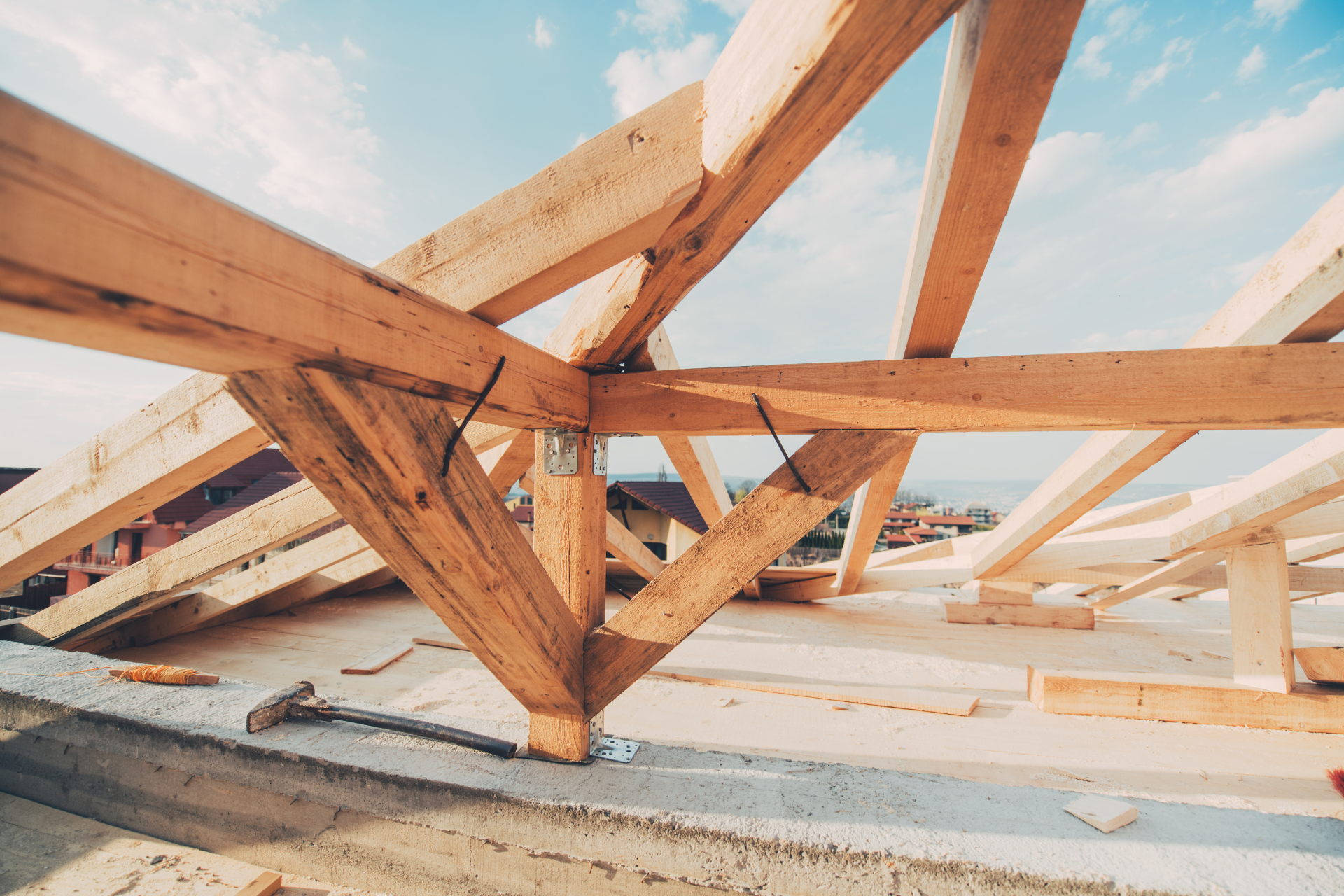 A wooden structure is being built on top of a building.
