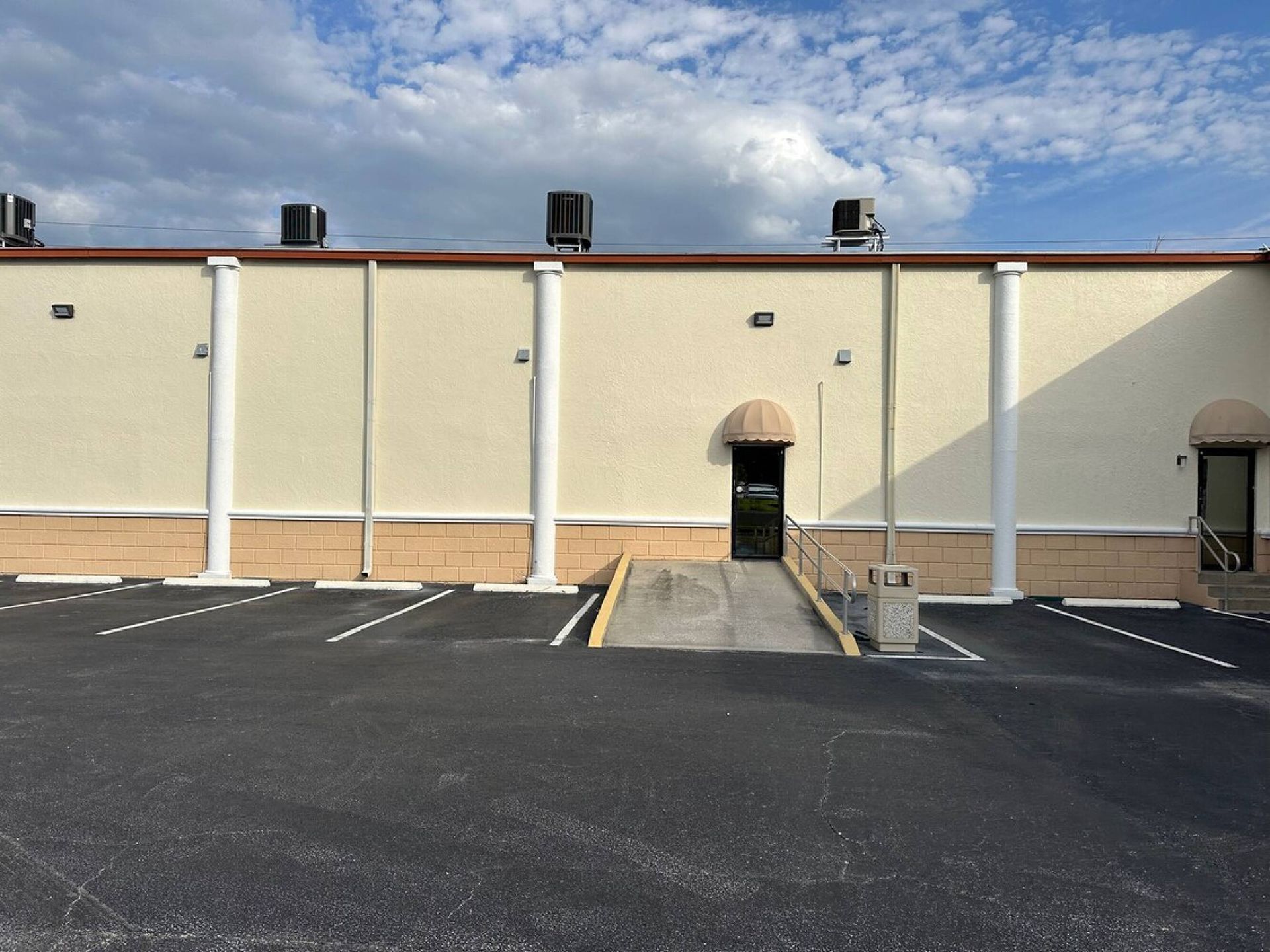A large building with a ramp leading to the door
