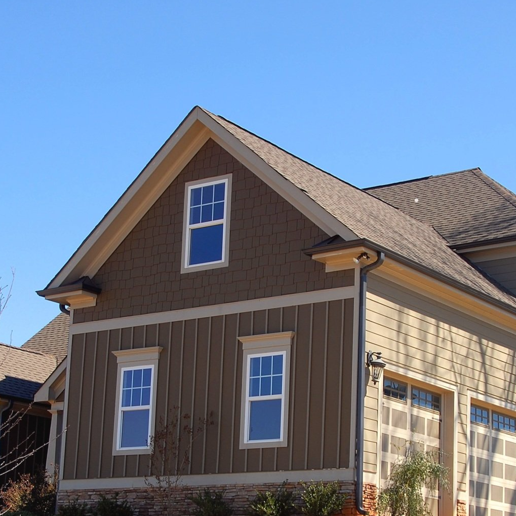 A house with a roof that has shingles on it
