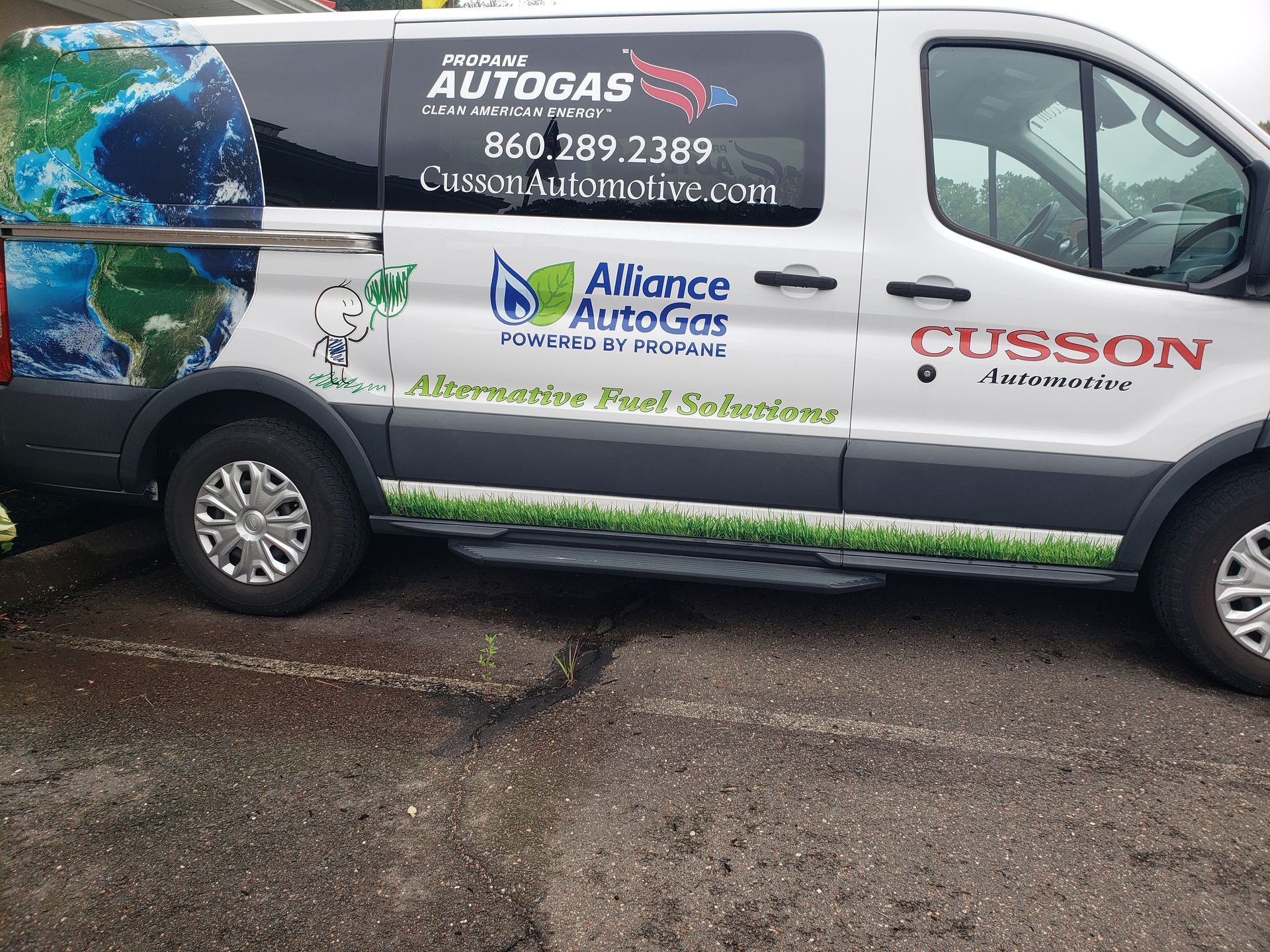 White service van with Autogas and Alliance Heating logos parked on wet pavement