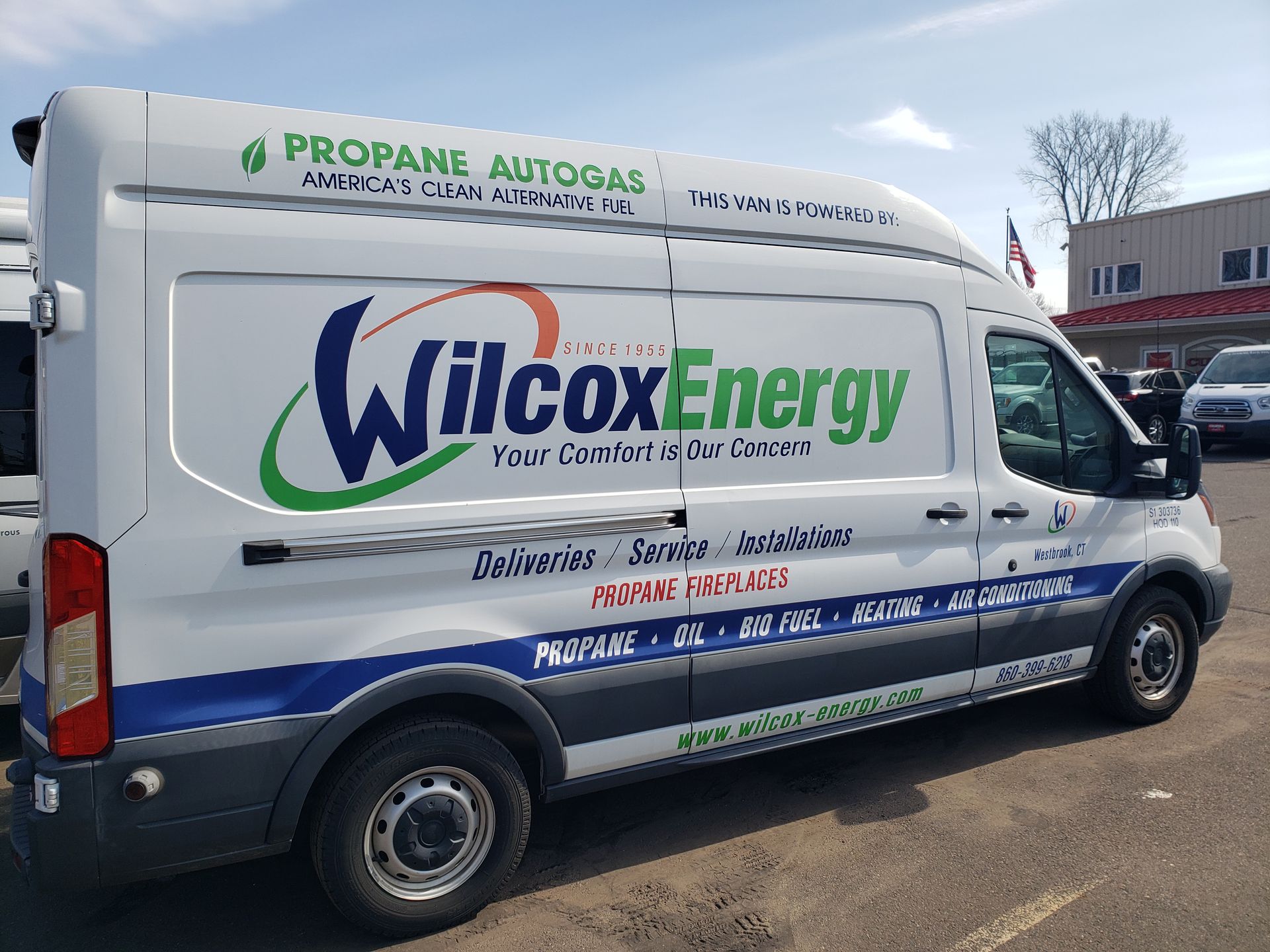 Wilcox Energy branded white service van parked outdoors on a sunny day