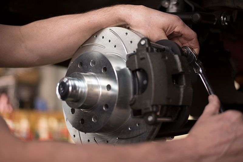 Person holding a disc brake — Pendle Hill, NSW — Pendle Hill Automotive
