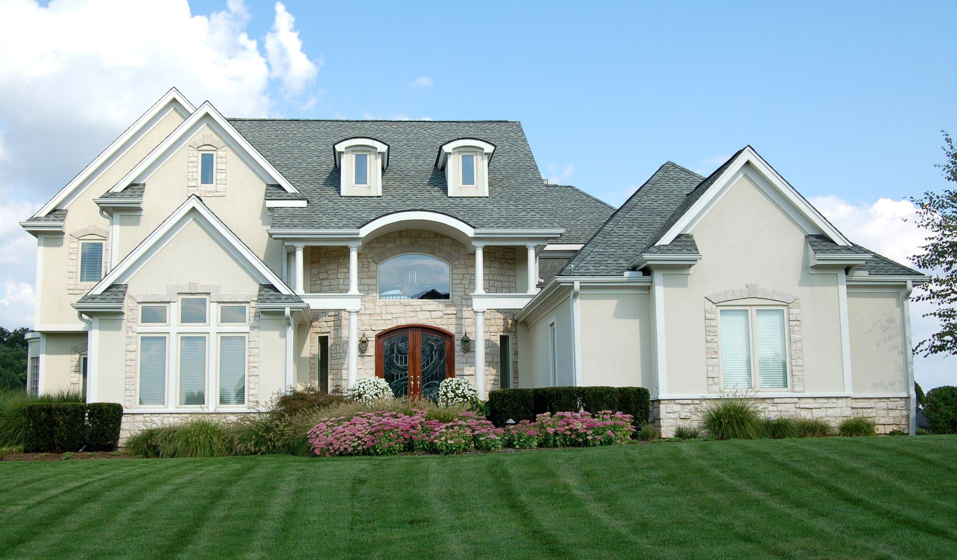 House with clouds above — Jordan, MN — Superior Stucco Inc.