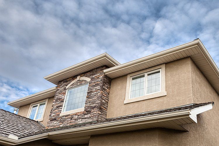 House with clouds above — Jordan, MN — Superior Stucco Inc.