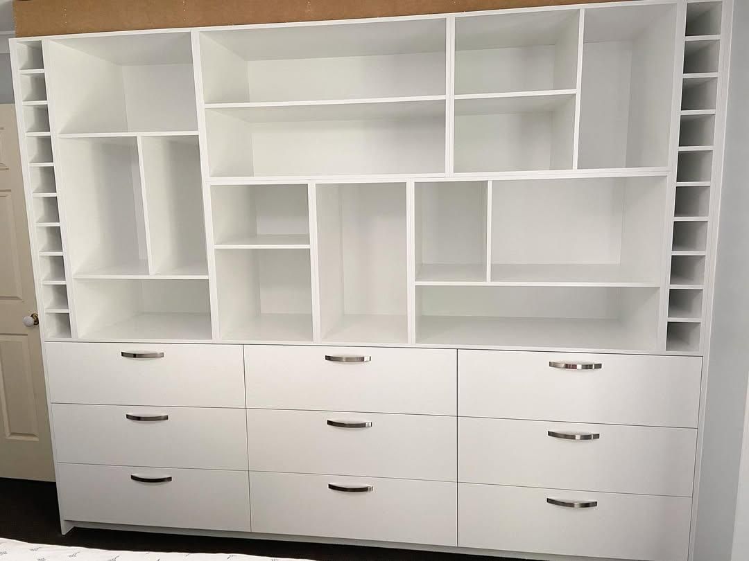 A Large White Shelf with Drawers and Shelves in A Room — Caldera Kitchens and Bathrooms in Lismore, NSW