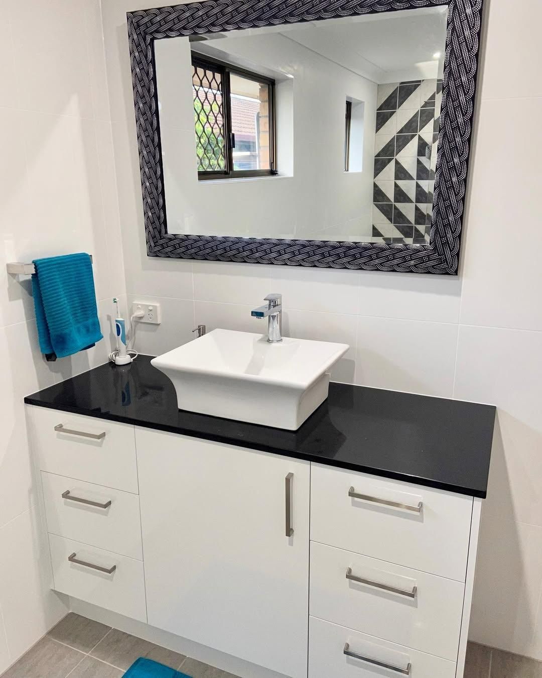 A Bathroom with A Sink and A Large Mirror — Caldera Kitchens and Bathrooms in Lismore, NSW