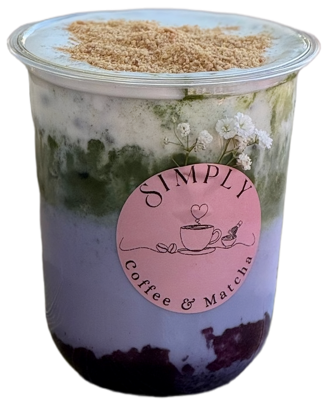 Layered purple and green coffee drink in a clear cup with a pink